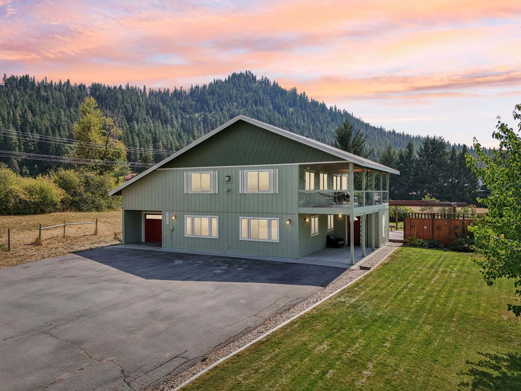 Front of the home at sunset with mountain backdrop